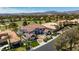 Expansive home featuring a tile roof, circular driveway, and landscaping in an exclusive neighborhood at 35 Ventana Canyon Dr, Las Vegas, NV 89113