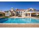 Gorgeous backyard with a sparkling pool and spacious patio, perfect for entertaining or unwinding in style at 35 Ventana Canyon Dr, Las Vegas, NV 89113