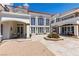 Elegant outdoor space featuring a fountain, covered patio, and manicured landscaping at 35 Ventana Canyon Dr, Las Vegas, NV 89113