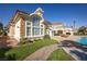 Stunning backyard showcasing a pristine pool, well-manicured lawn, and elegant architectural details at 35 Ventana Canyon Dr, Las Vegas, NV 89113