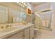 This tiled bathroom features a glass-enclosed tub-shower and a double vanity for convenience and style at 35 Ventana Canyon Dr, Las Vegas, NV 89113