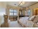 Bright bedroom with four poster bed, whimsical decor, and soft lighting at 35 Ventana Canyon Dr, Las Vegas, NV 89113