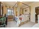 Bedroom featuring canopy bed, soft decor, and ample natural light at 35 Ventana Canyon Dr, Las Vegas, NV 89113