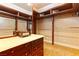 Custom walk-in closet featuring built-in drawers, shelving, and hanging rods for optimized organization and storage at 35 Ventana Canyon Dr, Las Vegas, NV 89113