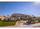 Beautiful home with manicured lawn and lush landscaping at 35 Ventana Canyon Dr, Las Vegas, NV 89113