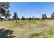 Beautiful view of golf course with trees in foreground at 35 Ventana Canyon Dr, Las Vegas, NV 89113