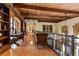 An upstairs hallway features hardwood floors and elegant shelving and leads to various rooms within the home at 35 Ventana Canyon Dr, Las Vegas, NV 89113