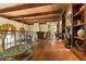 This hallway shows off custom wood trim, hardwood flooring, and entryways to various rooms in the home at 35 Ventana Canyon Dr, Las Vegas, NV 89113