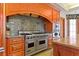 Kitchen with granite countertops, wooden cabinets, and stainless steel stove and oven at 35 Ventana Canyon Dr, Las Vegas, NV 89113