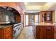 Kitchen featuring granite countertops, stainless steel appliances, and wooden cabinetry at 35 Ventana Canyon Dr, Las Vegas, NV 89113