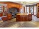 Spacious kitchen with wooden cabinets, stainless steel appliances, and stone floors at 35 Ventana Canyon Dr, Las Vegas, NV 89113