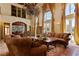 Spacious living room with a chandelier, high ceilings, and sophisticated decor, perfect for gatherings at 35 Ventana Canyon Dr, Las Vegas, NV 89113