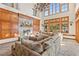 Cozy living room with a stone fireplace and exposed wood accents at 35 Ventana Canyon Dr, Las Vegas, NV 89113