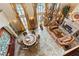 This stunning living room showcases a large chandelier, fireplace, and views of the pool and backyard at 35 Ventana Canyon Dr, Las Vegas, NV 89113