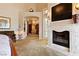 Spacious main bedroom boasts a fireplace, TV, elegant decor, and an open doorway to another room at 35 Ventana Canyon Dr, Las Vegas, NV 89113
