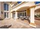 Inviting outdoor patio area featuring comfortable seating and a covered space for relaxing and entertaining guests at 35 Ventana Canyon Dr, Las Vegas, NV 89113