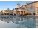 Serene pool view reflecting the elegant home, showcasing luxurious outdoor living and architectural beauty at 35 Ventana Canyon Dr, Las Vegas, NV 89113
