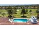 A pristine swimming pool and golf course views define this luxurious backyard setting at 35 Ventana Canyon Dr, Las Vegas, NV 89113