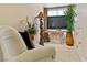 Cozy sitting area with comfortable seating, TV and decorative plants at 35 Ventana Canyon Dr, Las Vegas, NV 89113