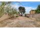 Large, fenced backyard with sheds offers a private outdoor space at 3575 W Robindale Rd, Las Vegas, NV 89139