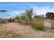 A large backyard enclosed by block walls and a gate offers a private outdoor space at 3575 W Robindale Rd, Las Vegas, NV 89139