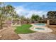 Backyard pool and hot tub with desert landscaping at 3575 W Robindale Rd, Las Vegas, NV 89139