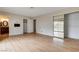 Main bedroom with laminate floors, closet, ensuite access and sliding glass doors to backyard at 3575 W Robindale Rd, Las Vegas, NV 89139