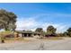 Traditional single story home with desert landscaping and a brick driveway at 3575 W Robindale Rd, Las Vegas, NV 89139