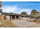 Traditional single story home featuring desert landscaping and a brick driveway at 3575 W Robindale Rd, Las Vegas, NV 89139