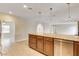 View of an open kitchen with granite countertops and stainless steel appliances at 3575 W Robindale Rd, Las Vegas, NV 89139