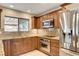 Close up of a renovated kitchen with granite countertops, and stainless steel appliances at 3575 W Robindale Rd, Las Vegas, NV 89139