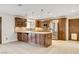Open kitchen featuring granite countertops, stainless steel appliances, and a tile floor at 3575 W Robindale Rd, Las Vegas, NV 89139