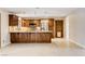 Open kitchen featuring granite countertops, stainless steel appliances, and tile flooring at 3575 W Robindale Rd, Las Vegas, NV 89139