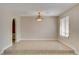 An open living area features tile floors and an arched doorway, offering a spacious design at 3575 W Robindale Rd, Las Vegas, NV 89139