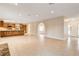 Open concept living space features tile flooring, neutral walls, and an arched doorway at 3575 W Robindale Rd, Las Vegas, NV 89139