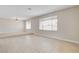 Spacious living room with large windows allowing for ample natural light at 3575 W Robindale Rd, Las Vegas, NV 89139
