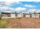 View of the backyard including covered patio and two storage sheds at 40 Laswell St, Henderson, NV 89015
