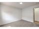 Bright bedroom featuring neutral carpeting and access to the bathroom at 40 Laswell St, Henderson, NV 89015