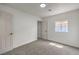 Bright bedroom featuring fresh white paint, plush gray carpet, and a modern ceiling light at 40 Laswell St, Henderson, NV 89015