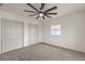 Carpeted bedroom with bright white walls and double door closet at 40 Laswell St, Henderson, NV 89015