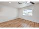 Bright bedroom features sleek hardwood floors, a ceiling fan, and natural light from the window at 40 Laswell St, Henderson, NV 89015