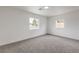 Bright bedroom featuring neutral carpeting and two windows at 40 Laswell St, Henderson, NV 89015