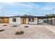 Single-story home with low-maintenance landscaping, covered parking area and bright orange front door at 40 Laswell St, Henderson, NV 89015
