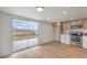 A kitchen and informal dining space overlooks a concrete patio area through a sliding glass door at 40 Laswell St, Henderson, NV 89015
