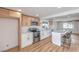 The kitchen features white quartz countertops, stainless steel appliances, and a breakfast bar with seating at 40 Laswell St, Henderson, NV 89015