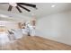 Open-concept kitchen features a breakfast bar, stainless steel appliances, and modern white and wood cabinets at 40 Laswell St, Henderson, NV 89015