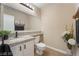 Well-lit bathroom features vanity, granite countertop, and large framed mirror at 4209 Glass Lantern Dr, North Las Vegas, NV 89032