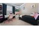 Cozy bedroom with black accents, a vanity, and decor at 4209 Glass Lantern Dr, North Las Vegas, NV 89032