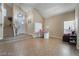Spacious entry area with tile floors, staircase, and plenty of natural light, perfect for welcoming guests at 4209 Glass Lantern Dr, North Las Vegas, NV 89032