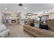 Open living space with tile floors, a fireplace, and seamless access to the kitchen and dining area at 4209 Glass Lantern Dr, North Las Vegas, NV 89032
